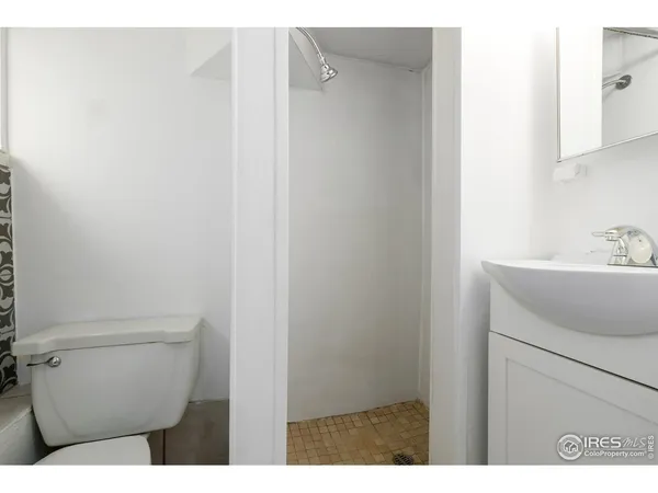 a bathroom with a sink toilet and