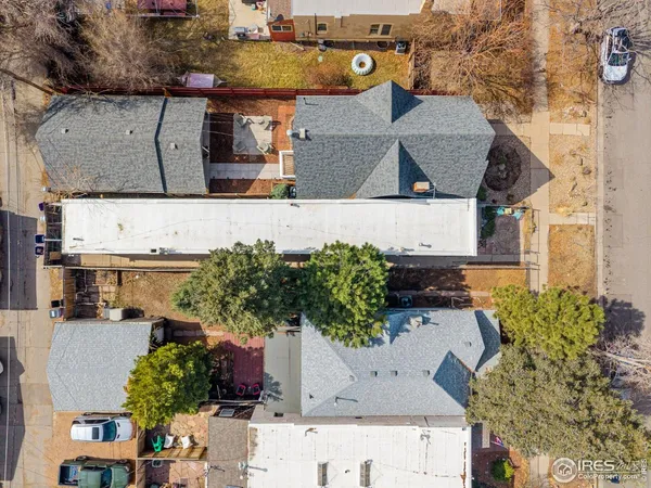an aerial view of a house with yard