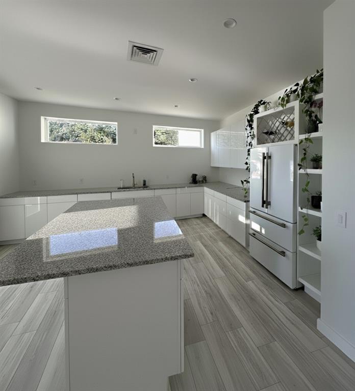 966 Wauka Ridge Road Cleveland, GA 30528 - Photo 11 of 16 a large bathroom with a large mirror vanity and shower