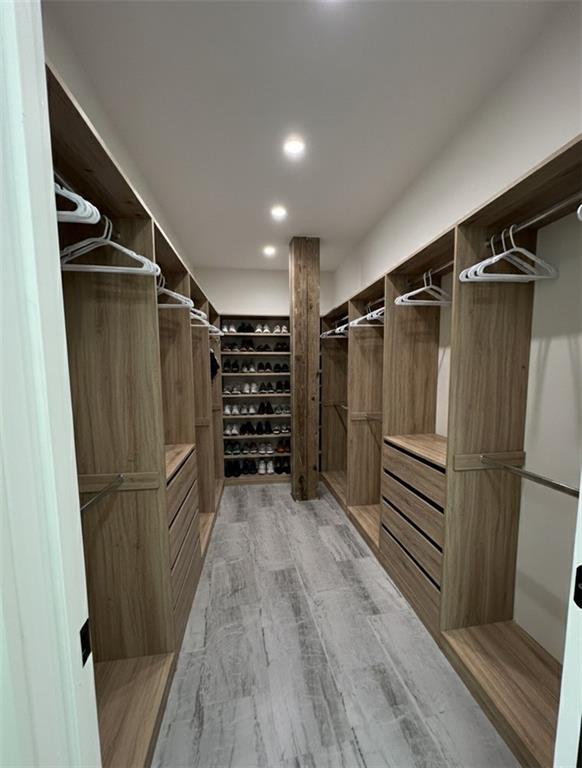 966 Wauka Ridge Road Cleveland, GA 30528 - Photo 15 of 16 a view of walk in closet with wooden floor and stairs