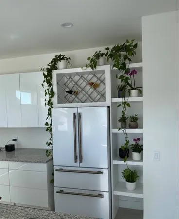 a view of a refrigerator in a kitchen