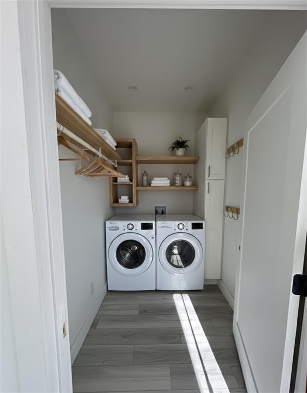 966 Wauka Ridge Road Cleveland, GA 30528 - Photo 10 of 16 a view of a storage and utility room with washer and dryer