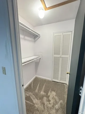 a bathroom with a glass door shower