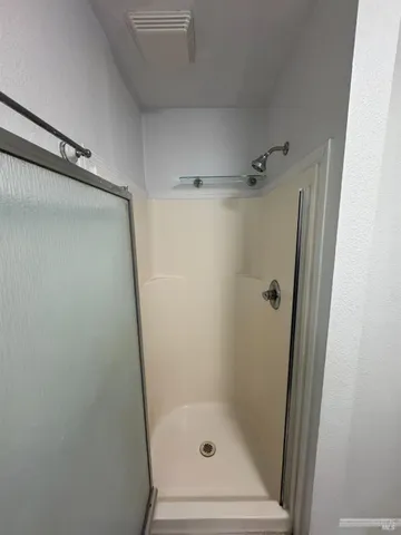 a view of a hallway with washer and dryer