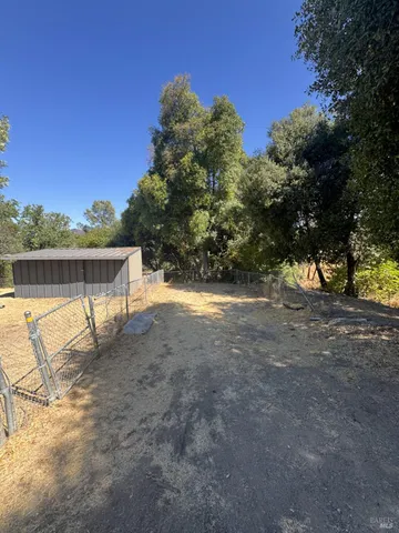 a view of a lake with a yard