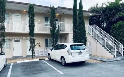 a view of a car park in front of house