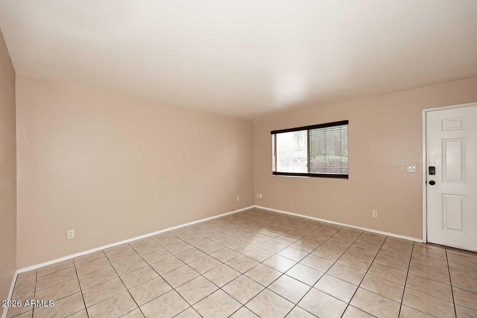 303 North Miller Road, Unit 1007 Scottsdale, AZ 85257 - Photo 8 of 45 a view of an empty room and window