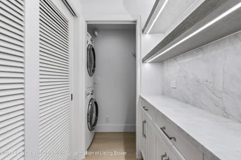 a bathroom with a toilet a sink and vanity