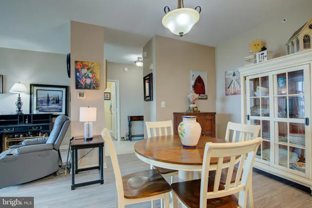 a living room with furniture and a mirror