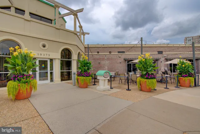 a view of a dining area with furniture and a kitchen