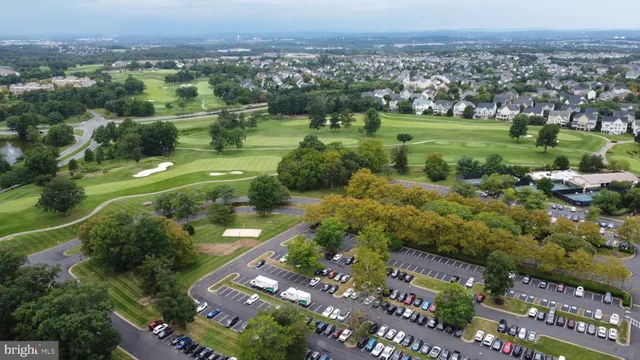 an aerial view of a house with outdoor space and street view