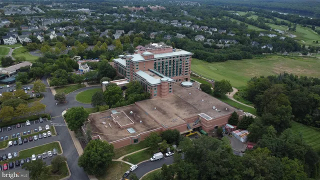 an aerial view of a house with a swimming pool