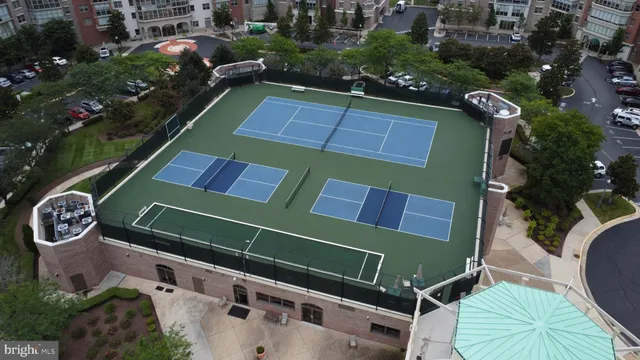 a balcony with furniture and a large window