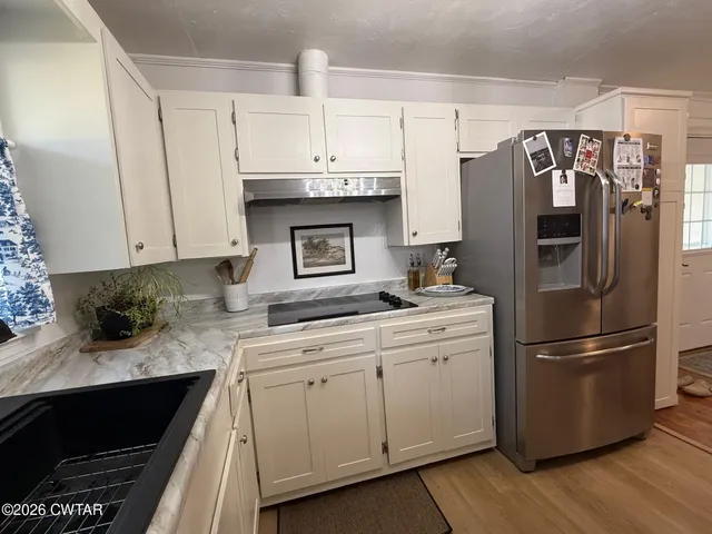 a view of a house with a small yard