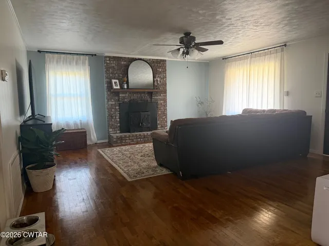 a kitchen with a sink dishwasher a stove and white cabinets