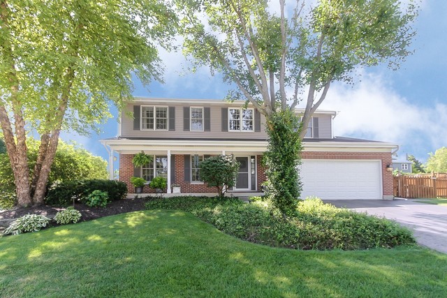 2850 Randall Ridge Drive Elgin, IL 60124 - Photo 1 of 19 a front view of a house with a garden and trees
