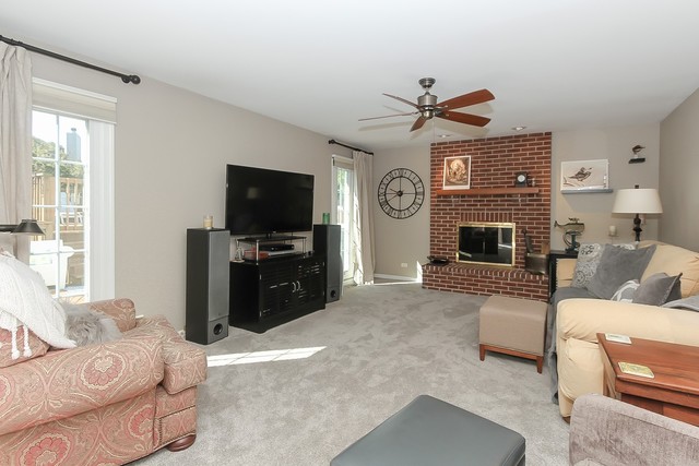 2850 Randall Ridge Drive Elgin, IL 60124 - Photo 9 of 19 a living room with furniture a flat screen tv and a fireplace