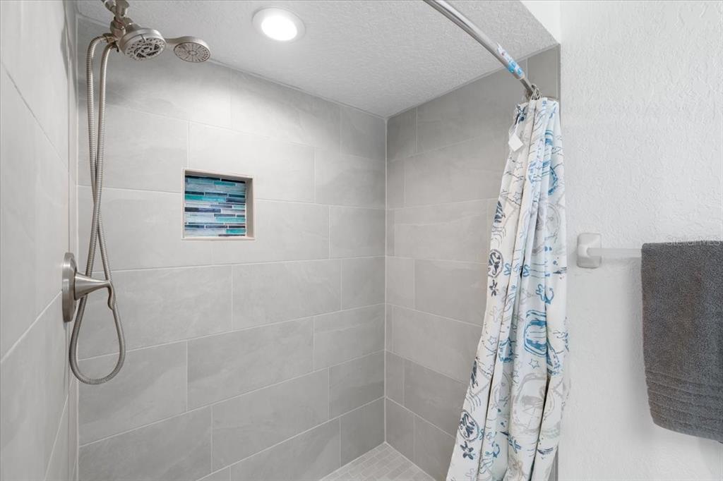 4400 Flexer Drive Hernando Beach, FL 34607 - Photo 16 of 49 a bathroom with a shower