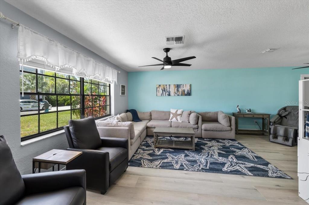4400 Flexer Drive Hernando Beach, FL 34607 - Photo 18 of 49 a living room with furniture a large window with outer view
