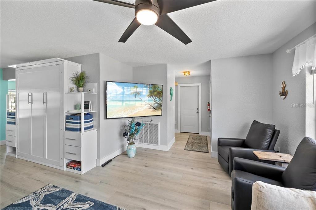 4400 Flexer Drive Hernando Beach, FL 34607 - Photo 19 of 49 a living room with furniture and a flat screen tv