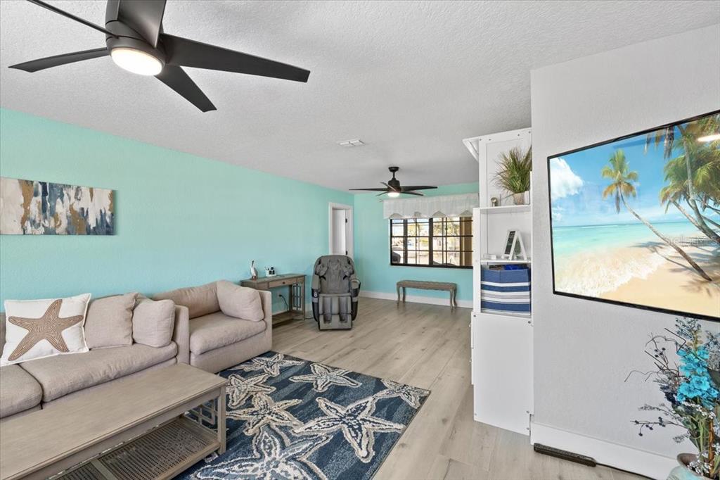 4400 Flexer Drive Hernando Beach, FL 34607 - Photo 20 of 49 a living room with furniture and wooden floor