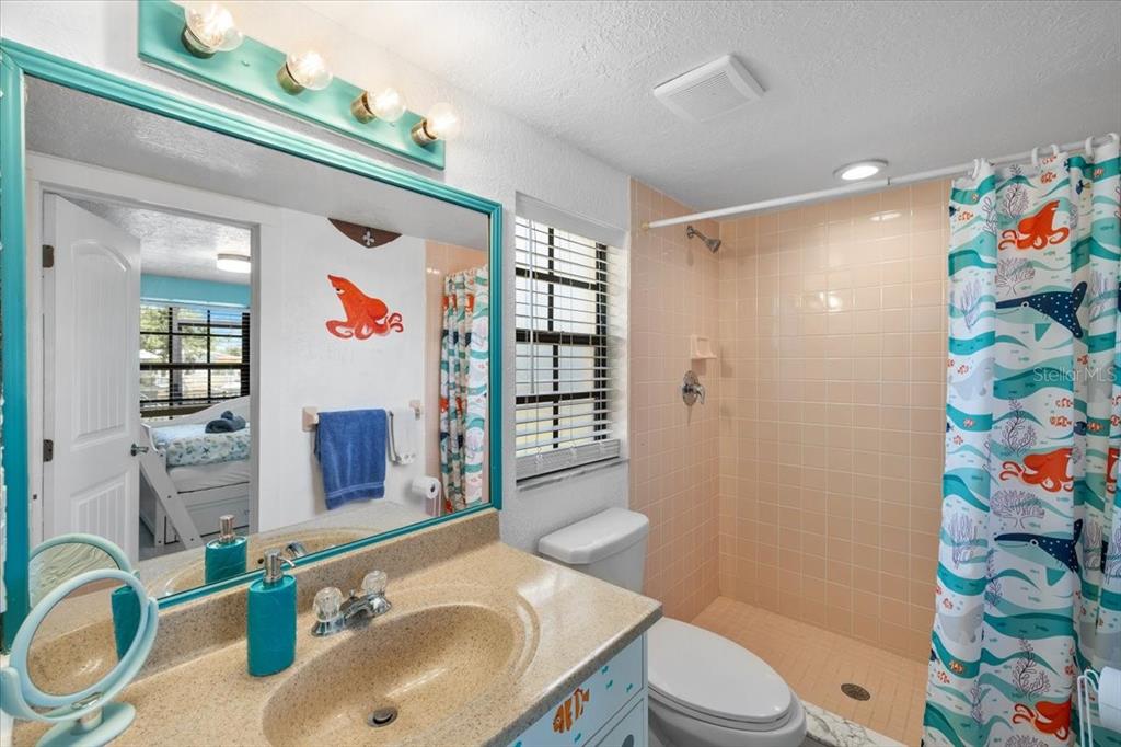 4400 Flexer Drive Hernando Beach, FL 34607 - Photo 30 of 49 a bathroom with a sink toilet and shower