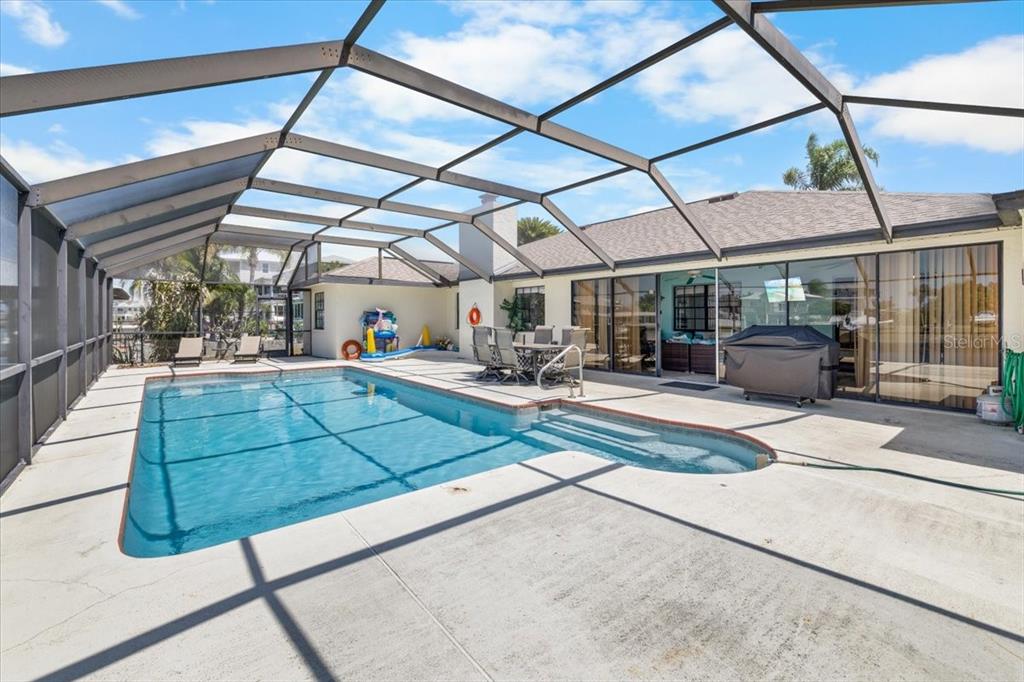 4400 Flexer Drive Hernando Beach, FL 34607 - Photo 35 of 49 a room with lots of table and chairs