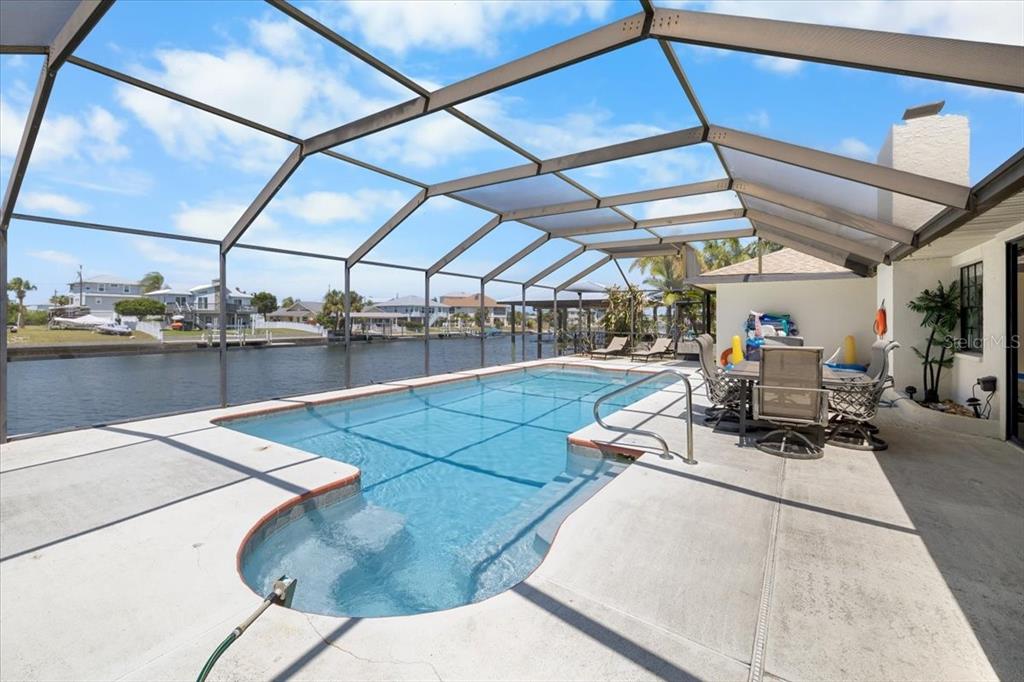 4400 Flexer Drive Hernando Beach, FL 34607 - Photo 37 of 49 a view of a patio with a table and chairs