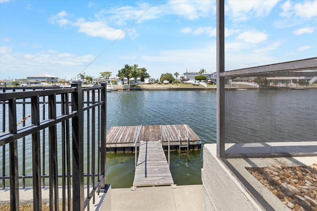 4400 Flexer Drive Hernando Beach, FL 34607 - Photo 38 of 49 a view of a balcony with wooden floor and lake view
