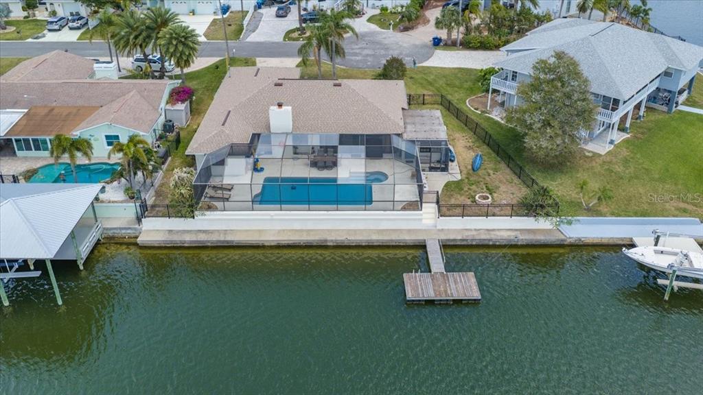 4400 Flexer Drive Hernando Beach, FL 34607 - Photo 4 of 49 an aerial view of a house with swimming pool and a yard