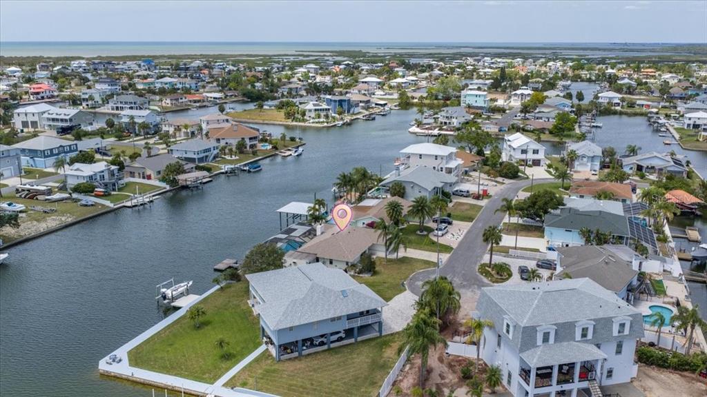 4400 Flexer Drive Hernando Beach, FL 34607 - Photo 41 of 49 an aerial view of a house with a lake view