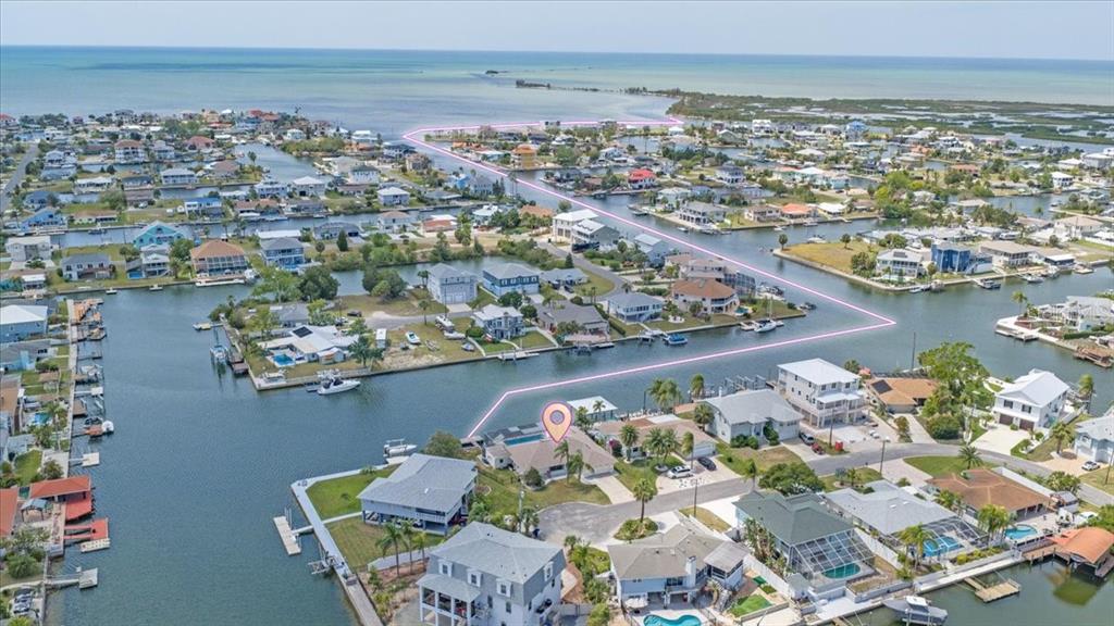 4400 Flexer Drive Hernando Beach, FL 34607 - Photo 45 of 49 an aerial view of a city with ocean view