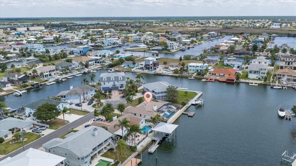 4400 Flexer Drive Hernando Beach, FL 34607 - Photo 47 of 49 an aerial view of a house with a lake view