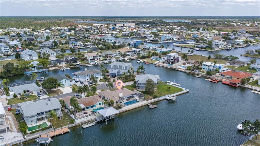 4400 Flexer Drive Hernando Beach, FL 34607 - Photo 48 of 49 an aerial view of a house with a lake view