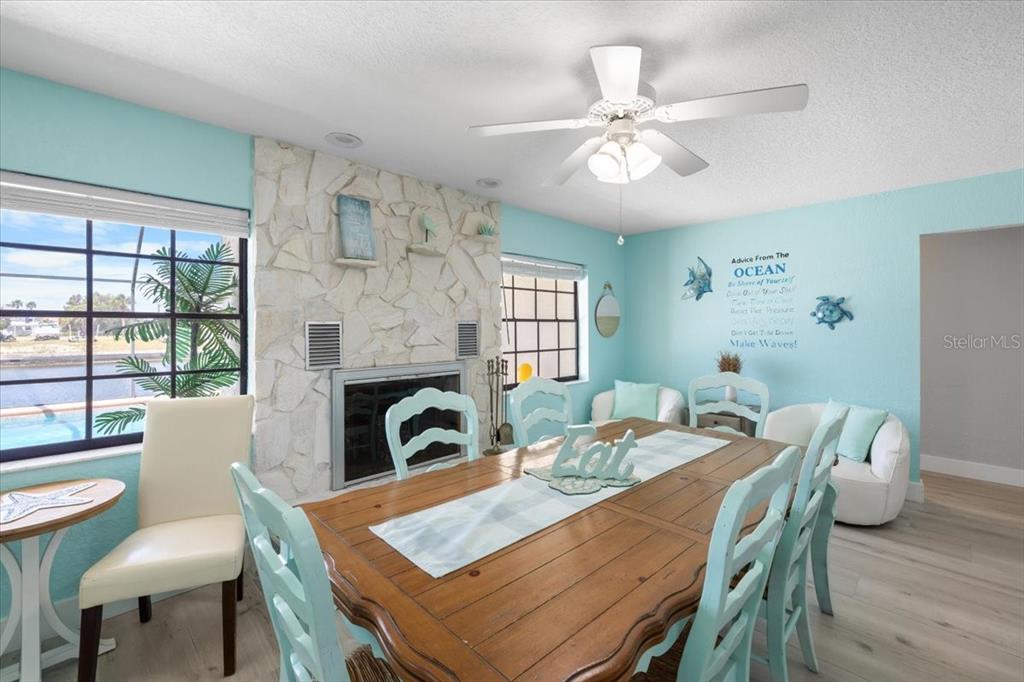 4400 Flexer Drive Hernando Beach, FL 34607 - Photo 9 of 49 a view of a dining room with furniture window and wooden floor