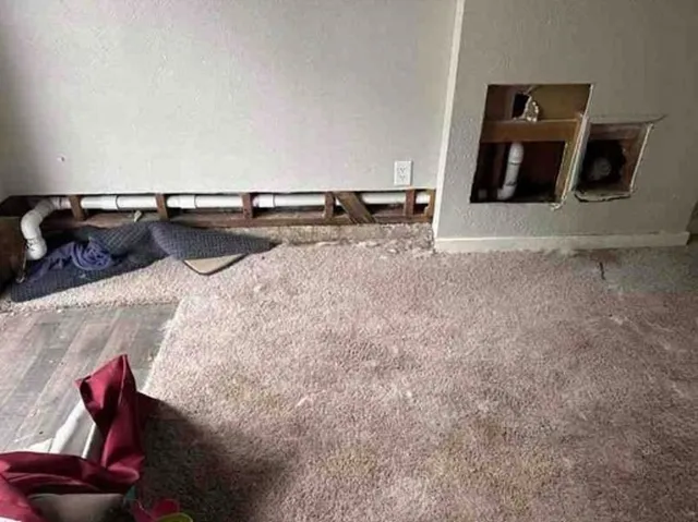 a view of kitchen with stainless steel appliances kitchen island sink refrigerator and stove