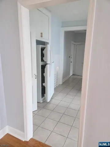 a view of a hallway with closet