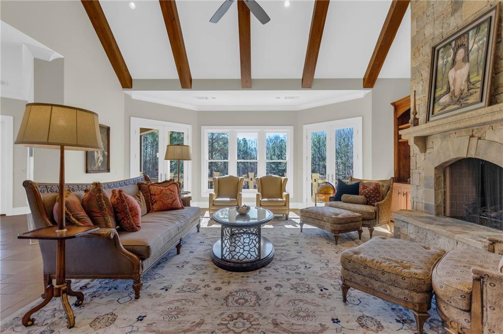 1086 Arbor Hill Road Canton, GA 30115 - Photo 14 of 98 a living room with furniture a fireplace and a flat screen tv