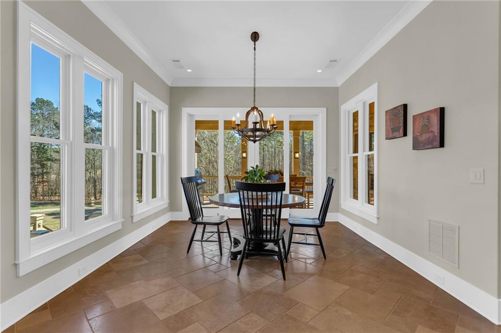 1086 Arbor Hill Road Canton, GA 30115 - Photo 15 of 98 a dining room with furniture window and outside view
