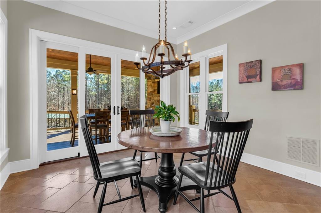1086 Arbor Hill Road Canton, GA 30115 - Photo 16 of 98 a view of a dining room with furniture window and outside view