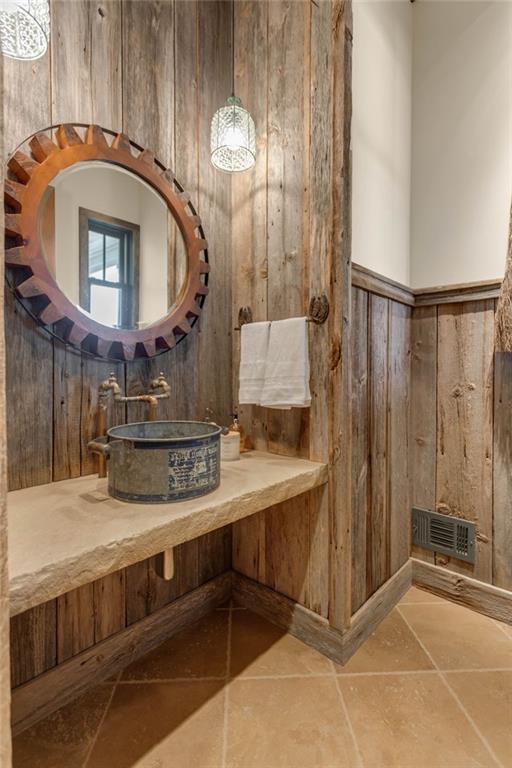 1086 Arbor Hill Road Canton, GA 30115 - Photo 23 of 98 a bathroom with a sink a mirror and a shower