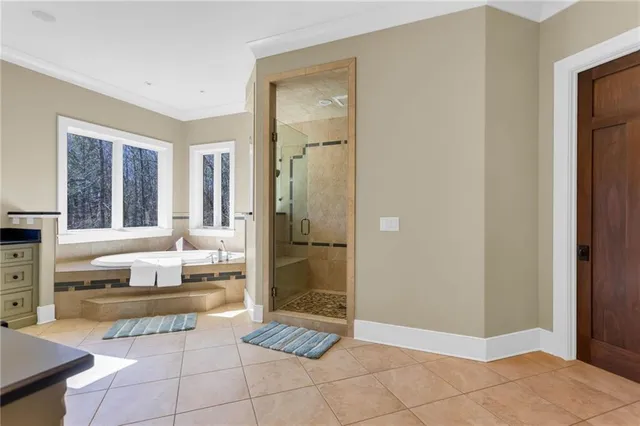 a dining room with wooden floor a table and chairs