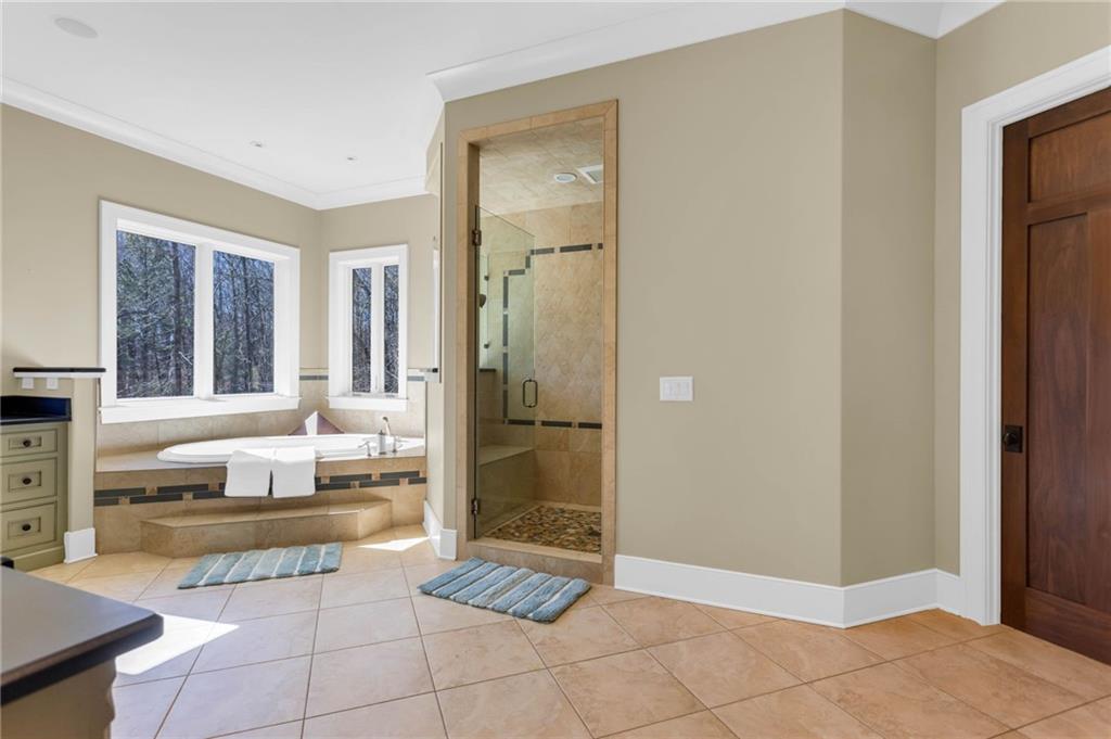 1086 Arbor Hill Road Canton, GA 30115 - Photo 26 of 98 a spacious bathroom with a tub shower and sink