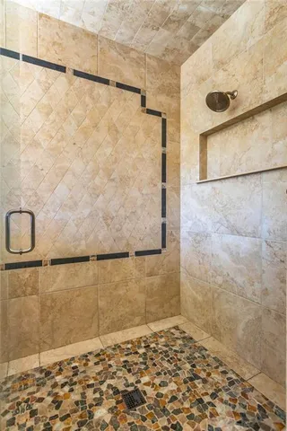 a spacious bedroom with a bed and a window