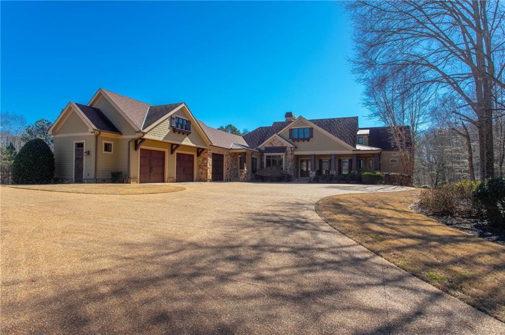 1086 Arbor Hill Road Canton, GA 30115 - Photo 3 of 98 a front view of a house with a garden
