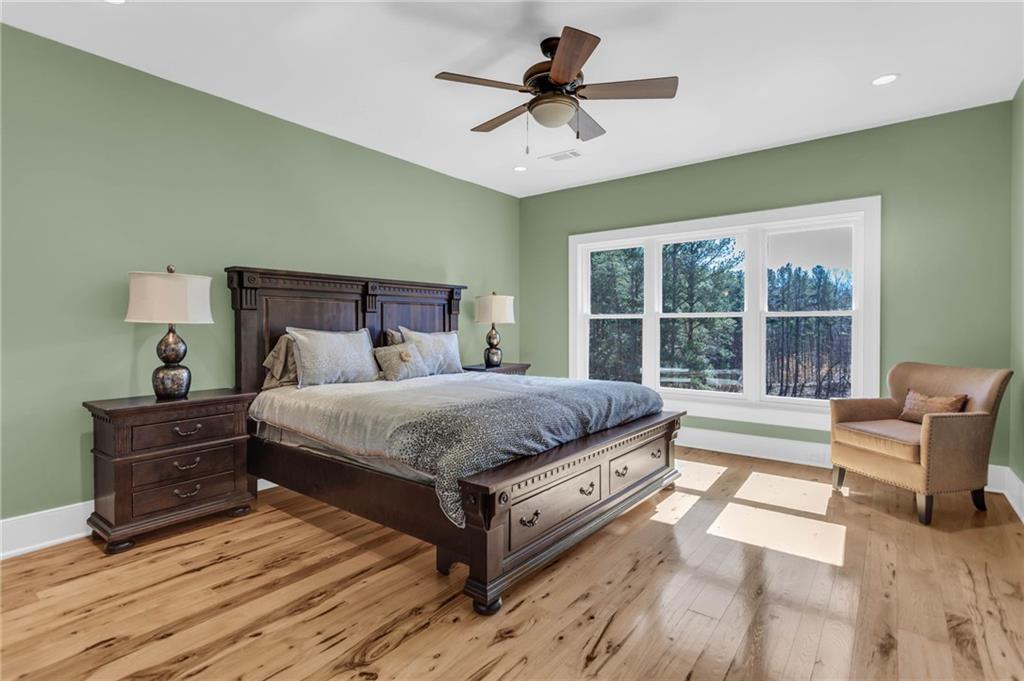 1086 Arbor Hill Road Canton, GA 30115 - Photo 40 of 98 a bed sitting in a spacious bedroom next to a window