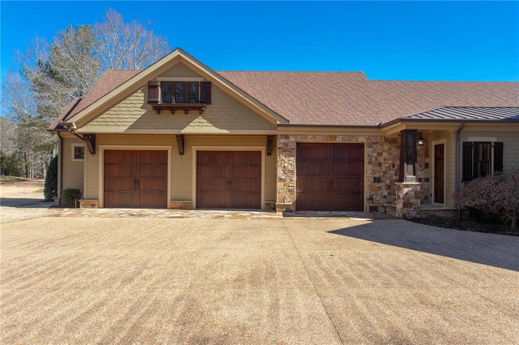 1086 Arbor Hill Road Canton, GA 30115 - Photo 4 of 98 a front view of a house with a yard and garage