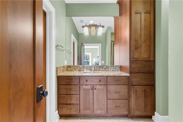 a view of a patio with table and chairs and wooden floor