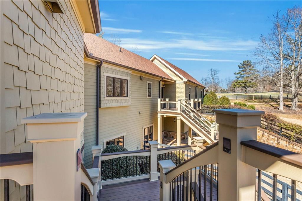1086 Arbor Hill Road Canton, GA 30115 - Photo 47 of 98 a view of a house with wooden stairs and a table