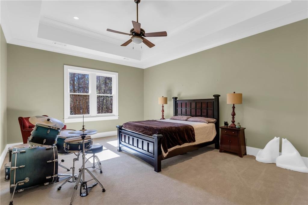 1086 Arbor Hill Road Canton, GA 30115 - Photo 53 of 98 a spacious bedroom with a bed and a window